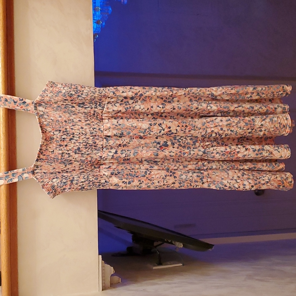 Summery floral dress with ruched detailing.